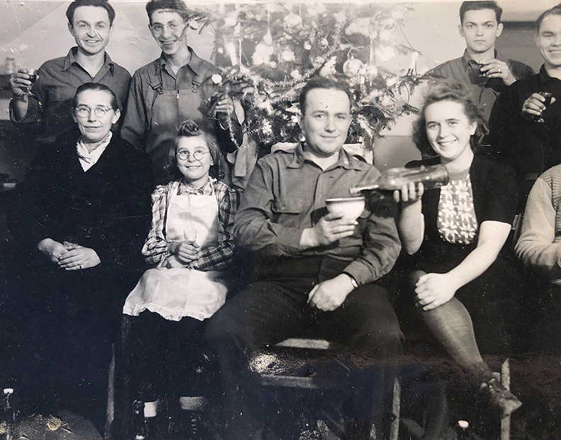 Allen Schwartz (back row, second from the left) with the Aime family and other unidentified soldiers.